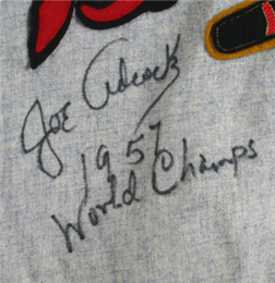 Joe Adock's signature on jersey.