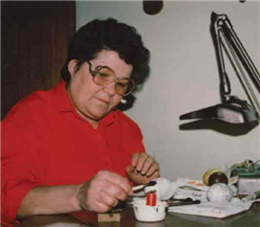 Betty Pisio Christenson decorating egg