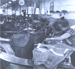 Employees sew garments in an OshKosh B'Gosh factory