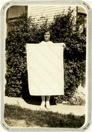 Elda Strahm holding her quilt