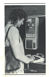 A woman using the teletype machine