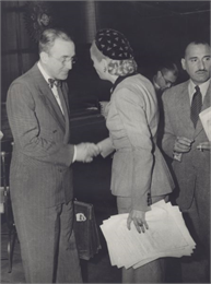 Arthur J. Altmeyer, President of the Permanent Inter-American Committee on Social Security, greeting Eva Peron, President of the Inter-American Conference on Social Security meeting in Buenos Aires.