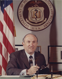 Portrait of Wilbur J. Cohen sitting at his desk as Secretary of Health, Education and Welfare. Social Security Administration was his responsibility.