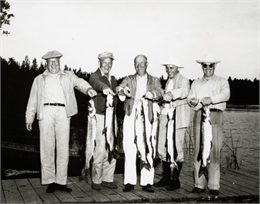 Dwight D. Eisenhower and his brothers on a fishing trip proudly exhibit muskies and northern pike on a Wisconsin lake. From left are Dwight, Edgar, Milton, and Roy Eisenhower.