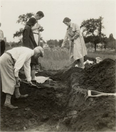 W.P. and Vivian Morgan and Grace Rollins excavate a burial mound.
