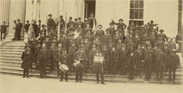 Group portrait of veterans of the 36th Wisconsin Regiment posed on the steps of the Wisconsin State Capital in the late 1870s.
