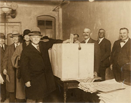 Senator Robert M. La Follette, Sr., a third-party presidential candidate, prepares to drop his ballot into the ballot box