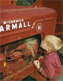 Young Boy Inspects Bird Nest on Farmall H Tractor