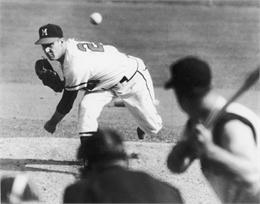 Black and white image of Warren Spahn pitching