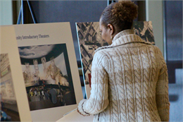 A woman looks over one of the early concept exhibit renderings prior to the "Share Your Voice" new museum listening session at Madison's Warner Park Community Recreation Center.