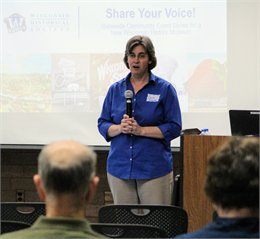 Carrie Ronnander, Executive Director and Curator of the Chippewa Valley Museum, welcomes guests to the Wisconsin Historical Society's "Share Your Voice" new museum session June 5, 2019 at the L.E. Phillips Memorial Library in Eau Claire.