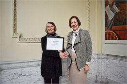 State Historic Preservation Officer Daina Penkiunas presents certificate to Martha Brown