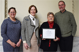 State Historic Preservation Officer Daina Penkiunas presented a certificate to Tamara Thomsen, Donna Georgeson and Paul Wolter