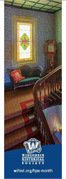 Color photo of the interior of Villa Louis featuring the staircase.