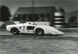 John Surtees in the Chaparral 2H-Chevrolet passes the Road America barn during the 1969 Can-Am.