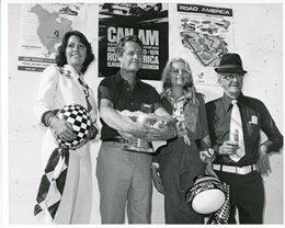 Scooter Patrick stands at the winners’ circle flanked by outgoing Miss Road America, Madonna Fowler, and incoming Miss Road America, Ali Kronke, along with Road America President Clif Tufte