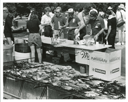 Fans enjoy corn on the cob at the 1987 IMSA 500 at Road America.