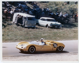 Bill Wuesthoff in a 2-liter Elva-Porsche passes spectators during the 1963 Road America 500.