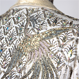 Close up of clothing garment with many sparkling jewels